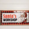 28” Wood and Metal Embossed “Santa’s Workshop” Wall Decor